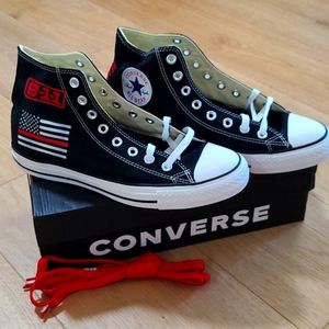 Converse Chuck Taylor high top canvas athletic shoes.